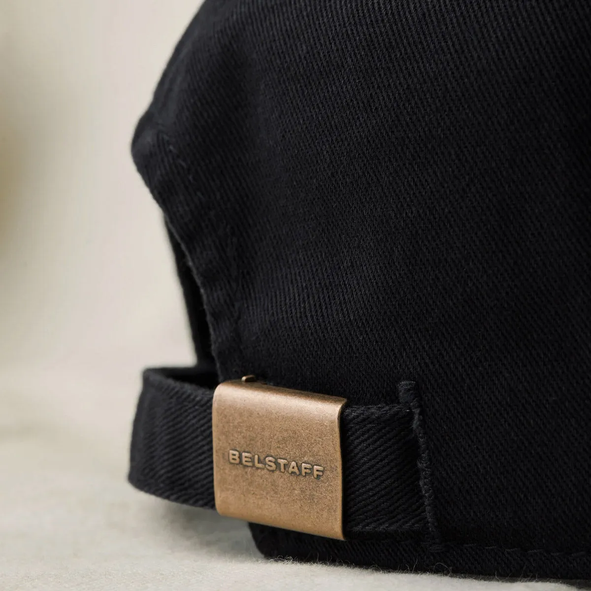 Belstaff black cap with Phoenix logo.