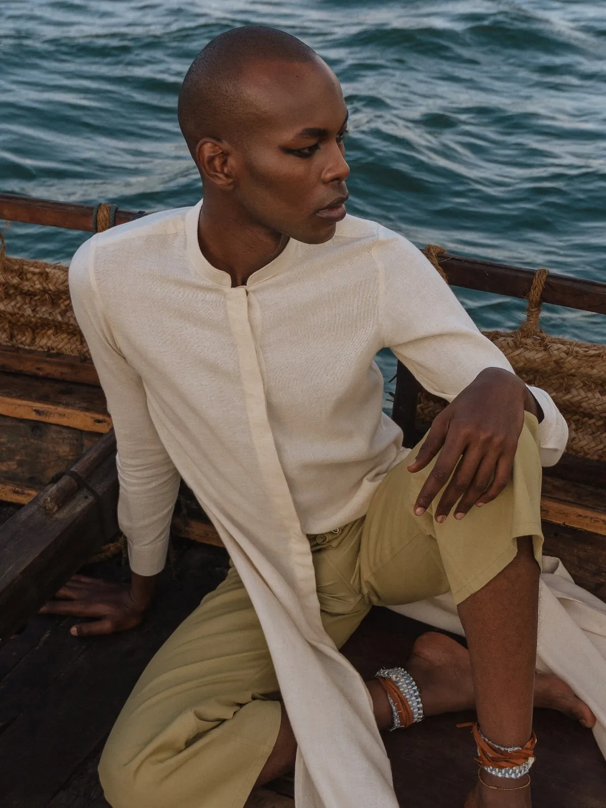 Kanzu Shirt: A traditional African shirt made from high-quality fabric, available in various designs and sizes. Perfect for cult