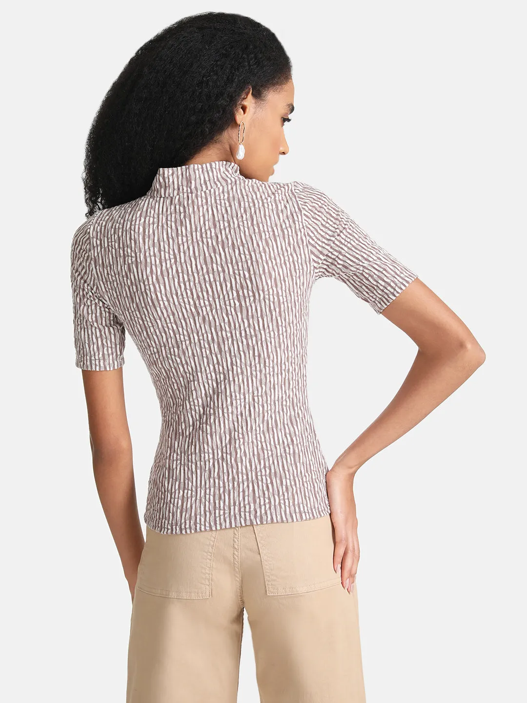 Turtleneck blouse.