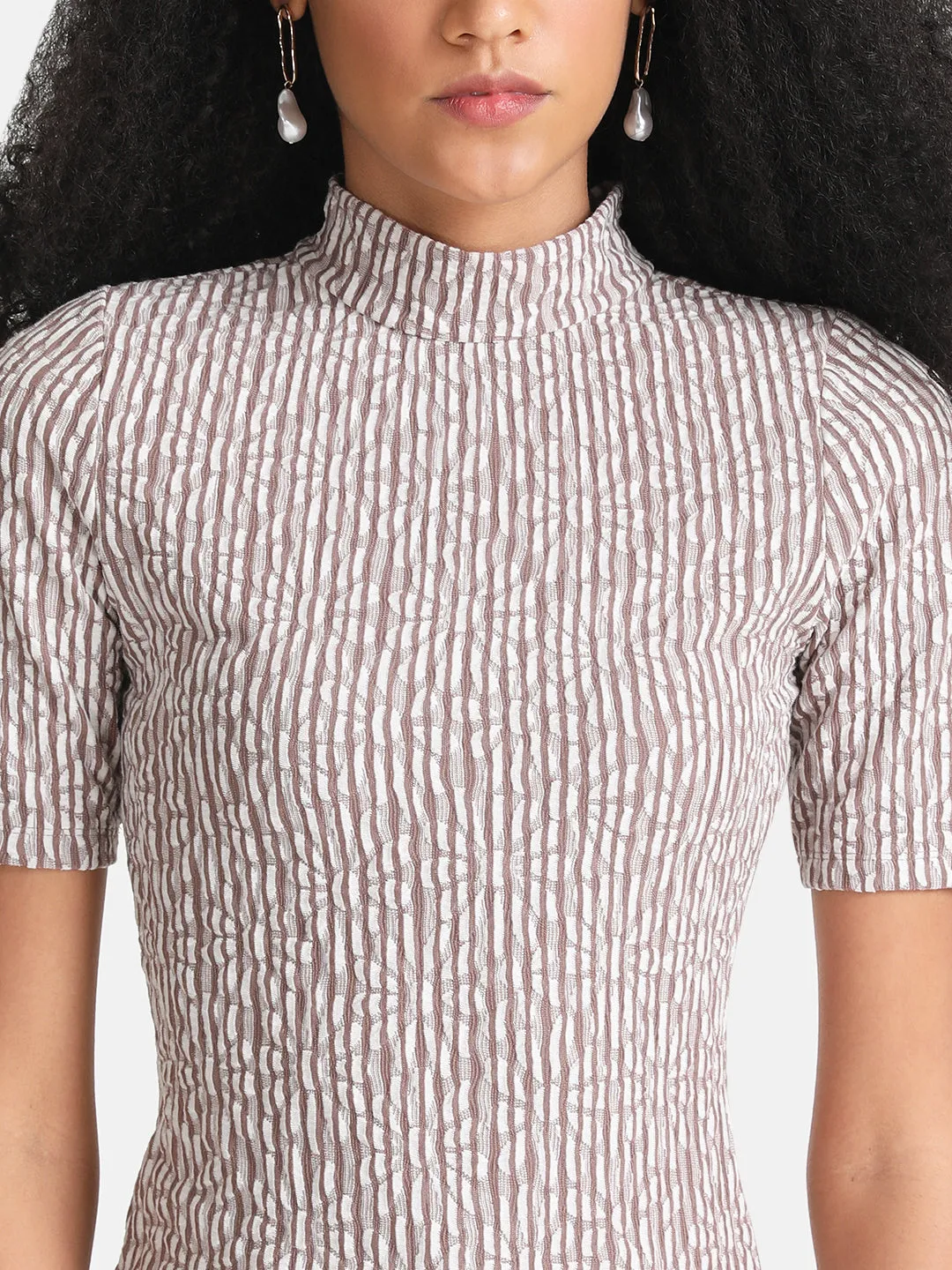 Turtleneck blouse.